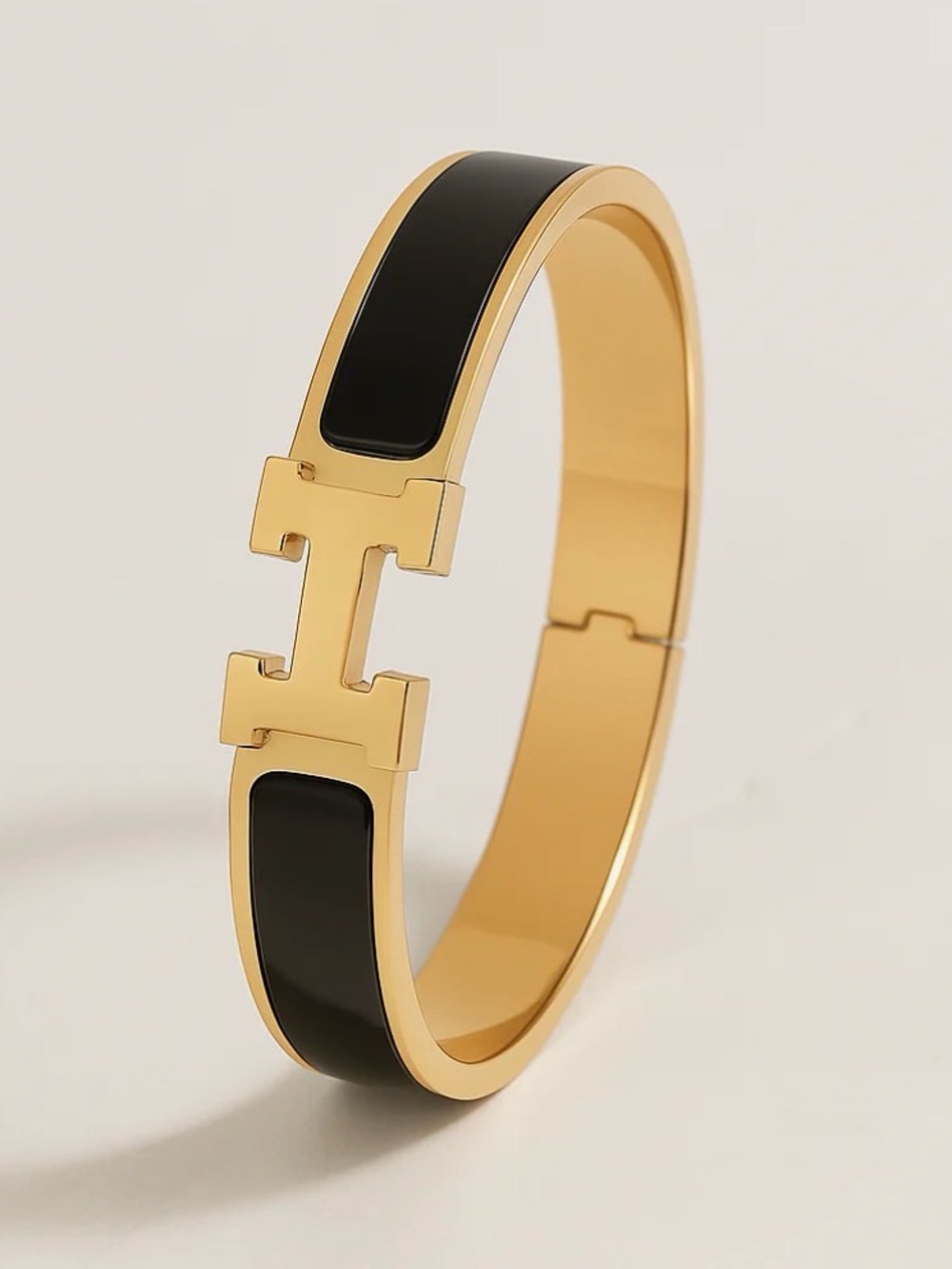 Gold stainless steel and Black with a gorgeous H fits a small wrist latch close - Picture 2 of 2